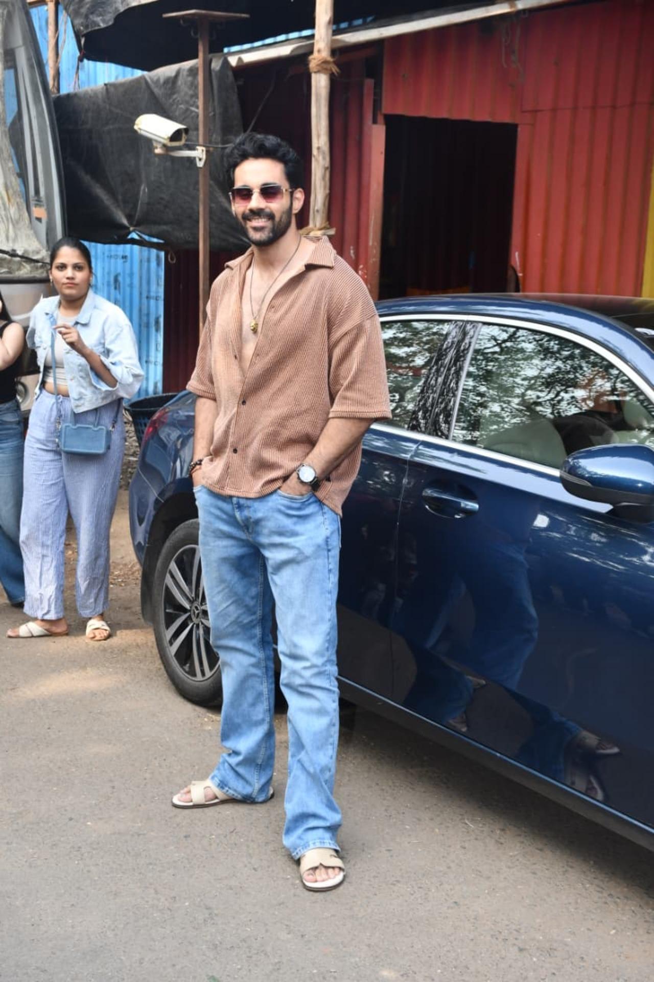 Abhishek Bajaj keeps it cool and effortless in this laid-back look. He’s wearing a relaxed, textured brown shirt left slightly unbuttoned, paired with easy blue jeans.